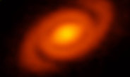 Thermal dust emission from the protoplanetary disk surrounding the young star Elias 2-27 clearly shows a spiral structure.