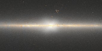 Abbildung 2: In dieser Karte der zentralen Regionen der Milchstraße ist die X-förmige Verteilung von Sternen sichtbar. Die Karte wurde von Dustin Lang aus Daten des NASA-Infrarotsatelliten WISE erstellt. Abbildung 2: In dieser Karte der zentralen Regionen der Milchstraße ist die X-förmige Verteilung von Sternen sichtbar. Die Karte wurde von Dustin Lang aus Daten des NASA-Infrarotsatelliten WISE erstellt.