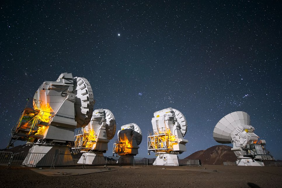ALMA antennas peer into the night at Chajnantor Plateau.