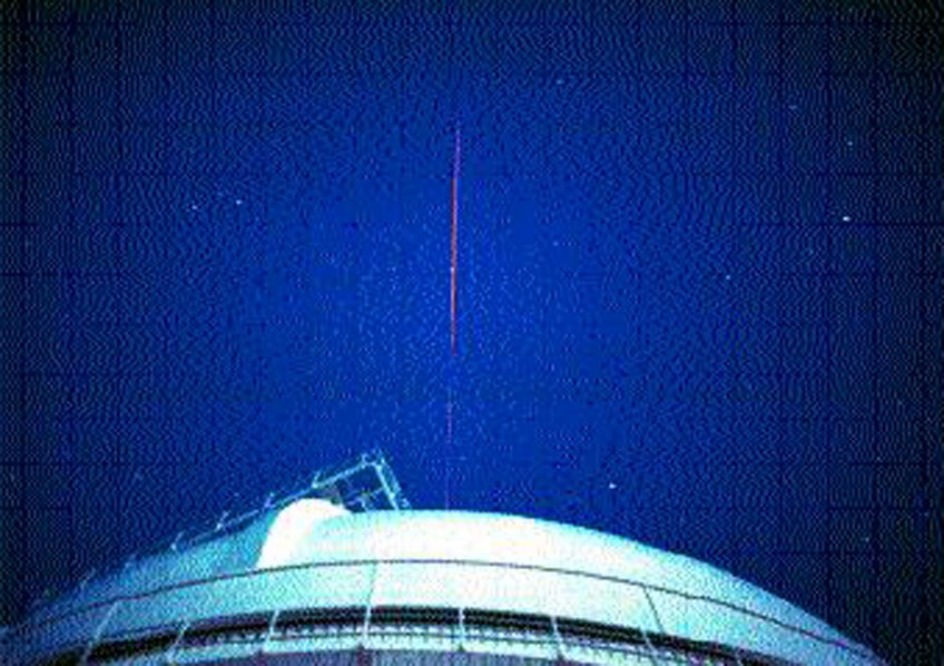 Fig. 3: The laser beam used to control the ALFA adaptive optics system is leaving the dome of the 3.5-m telescope. Fig. 3: The laser beam used to control the ALFA adaptive optics system is leaving the dome of the 3.5-m telescope.