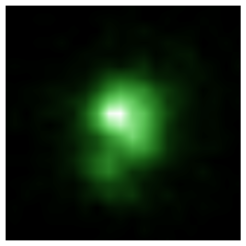 Die "Grüne-Erbsen-Galaxie" J0925+1403, aufgenommen mit dem Weltraumteleskop Hubble. Es handelt sich um ein geglättetes Falschfarbenbild, aufgenommen im nahen UV-Bereich (HST/COS zentriert um die Wellenlänge 230 nm), grün eingefärbt um dem Erscheinungsbild zu ähneln, welches Grüne-Erbsen-Galaxien bei Aufnahmen im sichtbaren Licht haben.Mit einem Durchmesser von nur rund 6000 Lichtjahren ist diese Galaxie weniger als 1/15 so groß wie unsere Milchstraße (genauer: deren sichtbare Anteile). Astronomen haben jetzt gemessen, dass rund 8% der UV-Strahlung, die diese Galaxie produziert, in den umgebenden Weltraum abstrahlen. Das reicht dafür aus, dass Galaxien dieses Typs die Schlüsselrolle bei der Reionisierung des Kosmos kurz nach dem Urknall hätten spielen können.
