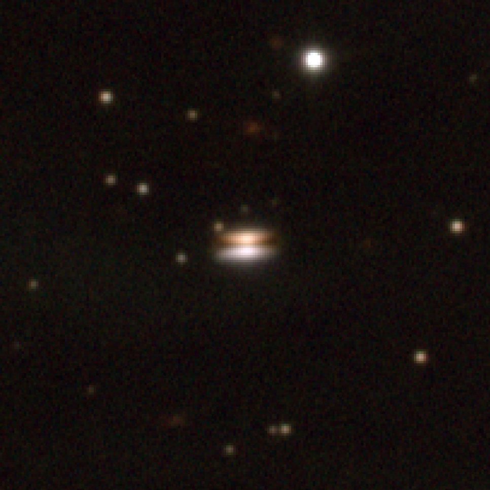 Near-infrared image of the Flying Saucer protoplanetary disk around the Sun-like young star 2MASS J16281370-2431391 obtained with the 8-m Very Large Telescope in 2001 (blue=J-band, green=H-band, and red=Ks-band; credit: ESO)