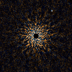 Figure 1: Near-infrared color composite images of a "second Jupiter" around the Sun-like star GJ 504 taken with the Subaru telescope. Light from the star, which would be in the center, has been suppressed mechanically and by image analysis methods. This is the coldest and possibly the lightest exoplanet ever imaged, and the first image of a planet orbiting a Sun-like (G type) star.