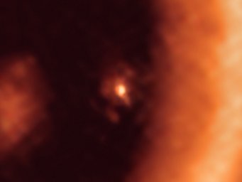 This image, taken with the Atacama Large Millimeter/submillimeter Array (ALMA), shows a close-up view on the moon-forming disc surrounding PDS 70c, a young Jupiter-like gas giant nearly 400 light-years away. It shows this planet and its disc centre-front, with the larger circumstellar ring-like disc taking up most of the right-hand side of the image. The dusty circumplanetary disc is as large as the Sun-Earth distance and has enough mass to form up to three satellites the size of the Moon. This image, taken with the Atacama Large Millimeter/submillimeter Array (ALMA), shows a close-up view on the moon-forming disc surrounding PDS 70c, a young Jupiter-like gas giant nearly 400 light-years away. It shows this planet and its disc centre-front, with the larger circumstellar ring-like disc taking up most of the right-hand side of the image. The dusty circumplanetary disc is as large as the Sun-Earth distance and has enough mass to form up to three satellites the size of the Moon.