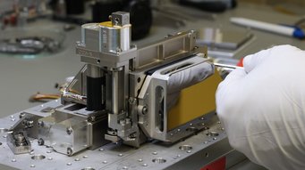 Fllght model of a 2-axis adjustment mechanism for the Roman Space Telescope. Its instrument CGI (Coronagraph Instrument) contains six of these units, which position optical elements with sub-micrometer accuracy in the optical beam path. Fllght model of a 2-axis adjustment mechanism for the Roman Space Telescope. Its instrument CGI (Coronagraph Instrument) contains six of these units, which position optical elements with sub-micrometer accuracy in the optical beam path.