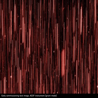 Early commissioning test image – NISP instrument (spectrograph). Spectrographs split the light of an object into its colour components in a similar way to a rainbow. Each stripe shows the spectrum of a galaxy. Early commissioning test image – NISP instrument (spectrograph). Spectrographs split the light of an object into its colour components in a similar way to a rainbow. Each stripe shows the spectrum of a galaxy.