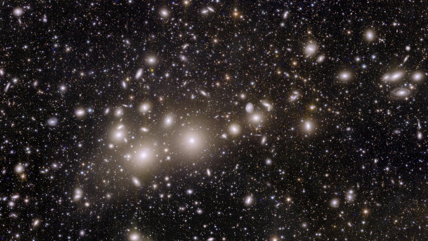 The Perseus Galaxy Cluster – This incredible snapshot from Euclid is major progress for astronomy. The image shows 1000 galaxies belonging to the Perseus Cluster, and more than 100 000 additional galaxies further away in the background.Many of these faint galaxies were previously unseen. Some of them are so distant that their light has taken 10 billion years to reach us. By mapping the distribution and shapes of these galaxies, cosmologists will be able to find out more about how dark matter shaped the Universe that we see today.This is the first time that such a large image has allowed us to capture so many Perseus galaxies in such a high level of detail. Perseus is one of the most massive structures known in the Universe, located ‘just’ 240 million light-years away from Earth. The Perseus Galaxy Cluster – This incredible snapshot from Euclid is major progress for astronomy. The image shows 1000 galaxies belonging to the Perseus Cluster, and more than 100 000 additional galaxies further away in the background.Many of these faint galaxies were previously unseen. Some of them are so distant that their light has taken 10 billion years to reach us. By mapping the distribution and shapes of these galaxies, cosmologists will be able to find out more about how dark matter shaped the Universe that we see today.This is the first time that such a large image has allowed us to capture so many Perseus galaxies in such a high level of detail. Perseus is one of the most massive structures known in the Universe, located ‘just’ 240 million light-years away from Earth.