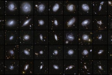 A collage of nine by five squares containing galaxies of many different shapes and viewed in different orientations. For example, the first column shows five edge-on galaxies, which appear thin like a pencil. The galaxies in the second column have a more fuzzy, diffuse appearance. The middle columns showcase face-on spiral galaxies with many different shapes and densities of stars. The last two columns include interacting galaxies or galaxies with an unusual spiral arm or tidal tail.