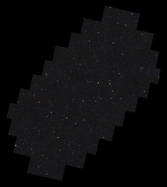 This is Euclid’s Deep Field South. After only one observation, the space telescope already spotted more than 11 million galaxies in this field. In the coming years, Euclid will make more observations of this field to reach its full depth. When looking at the image, a glimpse of the large-scale structure of the Universe can be seen. This is the organisation of galaxies along the so-called ‘cosmic web’. This web consists of huge clusters of galaxies connected to one another by strands of gas and invisible dark matter.Euclid’s Deep Field South covers 28.1 square degrees in the southern constellation of Horologium, the pendulum clock. This field has not been covered to date by any deep sky survey and so has a huge potential for new, exciting discoveries. On a black background lies a rectangular shape with stepped edges all around, oriented with its long axis pointing from bottom left to top right. Contained within the shape are more than 11 million galaxies, and stars of various size, brightness and colour. Some galaxies are easily identifiable by their fuzzy elongated shapes. There is a hint of more densely populated regions of galaxies being organised into a web-like structure of filaments that permeates the image.